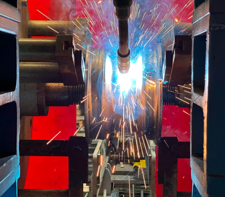 Robot welding a steel rim
