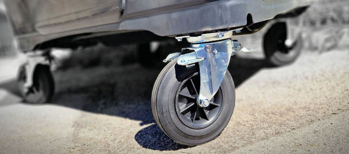 3 STOP castor with brake under a waste container