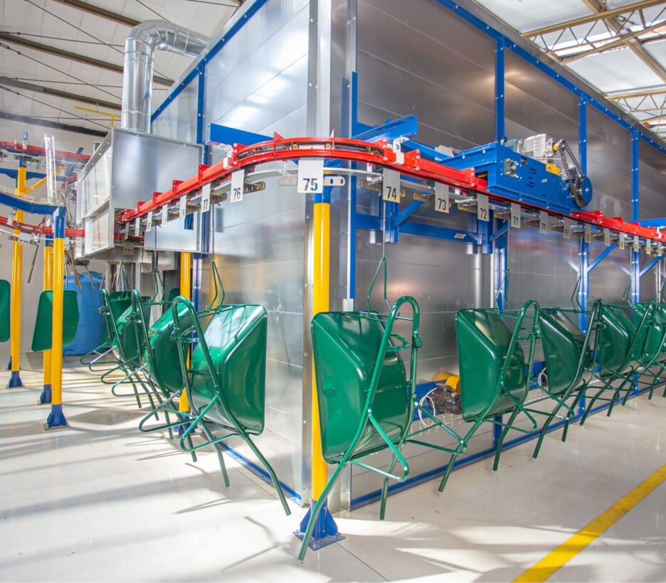 Wheelbarrow tubs on the powder coating line