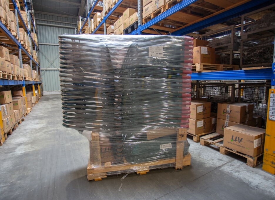 Pallet of stacked wheelbarrow tubs in the warehouse