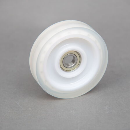 White plastic roller with ball bearing
