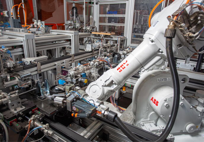 ABB robot in an automated castor assembly cell