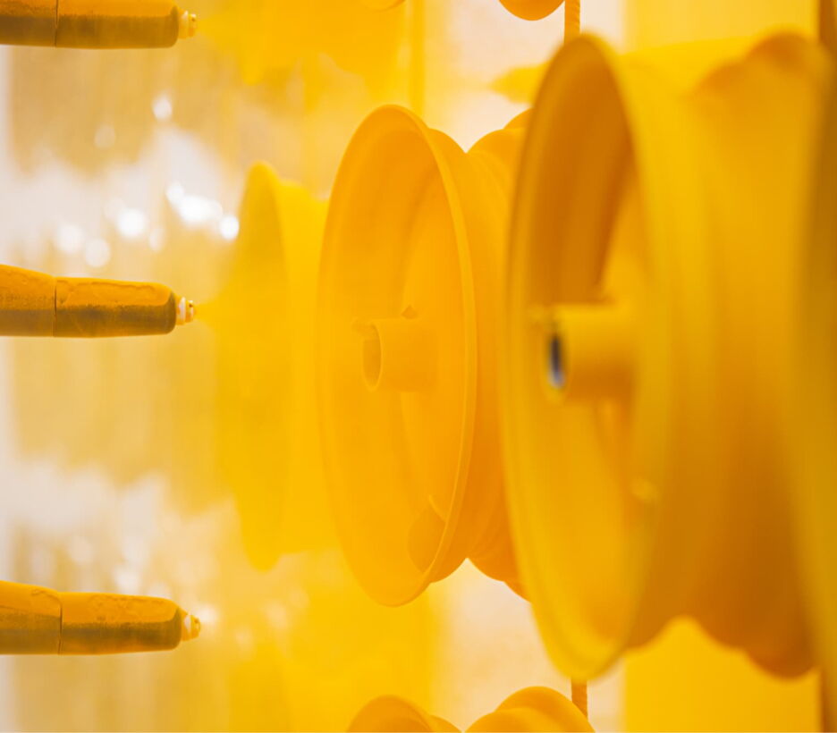 Yellow powder-coated rims on the line