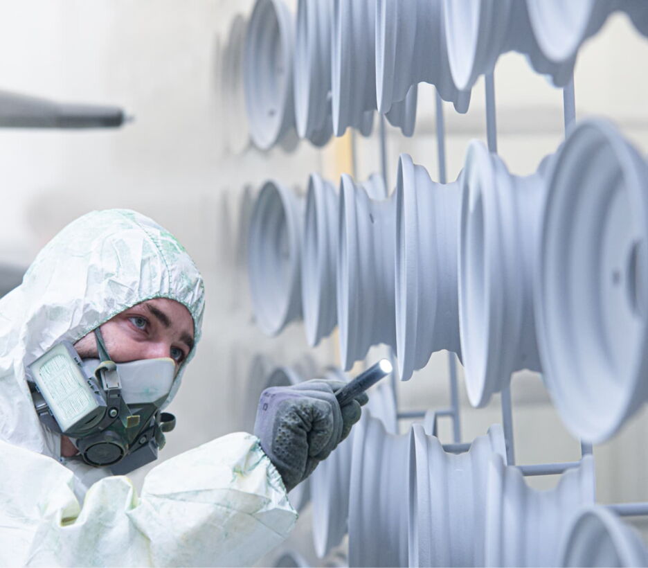Operator powder coating steel rims