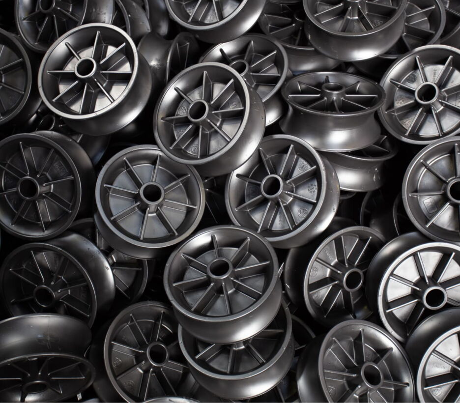 Black plastic wheel centres for waste container wheels